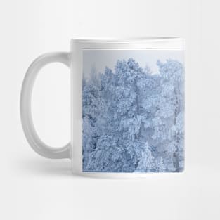 Trees covered in snow Mug